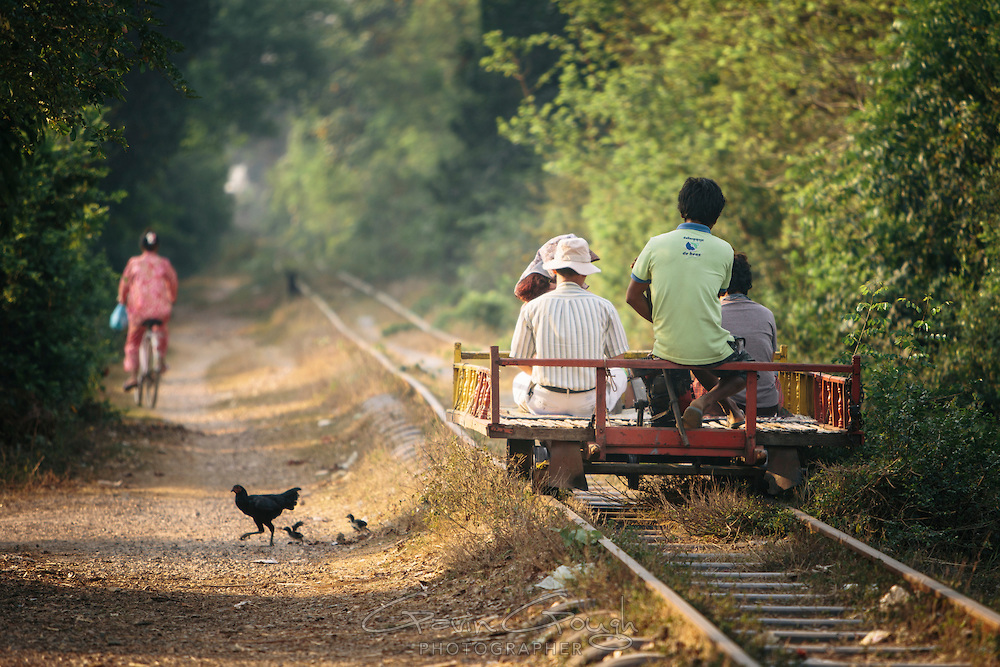 A homemade train or "Norry" made of bamboo and powered by a 6 horsepower gasoline engine travels along the Bamboo Train line, O Dambong, Battambang, Cambodia